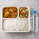 Affordable workforce meal with rice chicken curry salad and water UAE